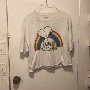 It’s a white crop top that has Snoopy and Woodstock it has a rainbow behind them